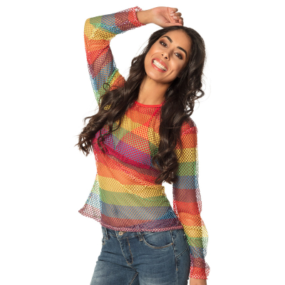 Smiling dancing woman with dark curly hair wears jeans with a long-sleeved fishnet shirt in rainbow colours on top.