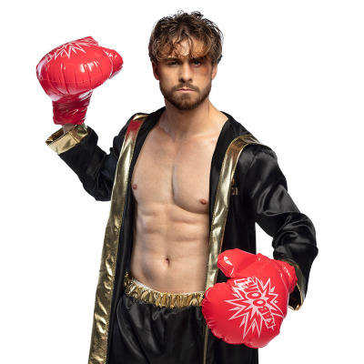 Boxer with black cape and red, inflatable boxing gloves.