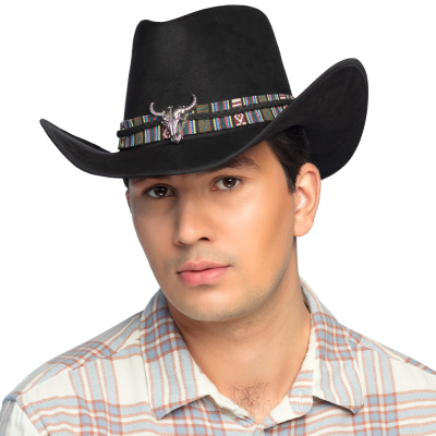 Man with flannel checked shirt has a black cowboy hat on with a fabric band with wild west pattern and silver bulls head as details.
