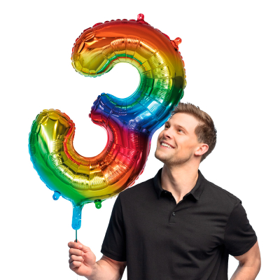 Rainbow-coloured foil balloon in the shape of the number 3.