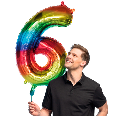 Rainbow coloured foil balloon in the shape of the numeral 6.