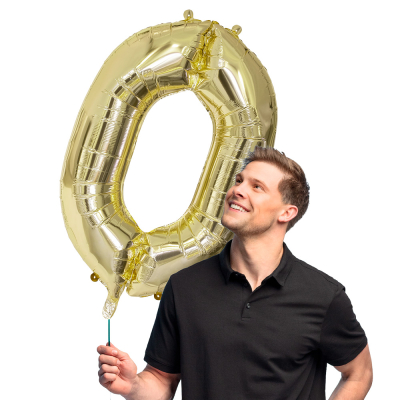 Gold foil balloon in the shape of the numeral 0.