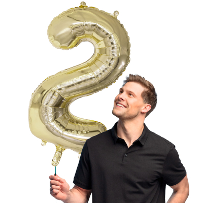Golden foil balloon in the shape of the numeral 2.