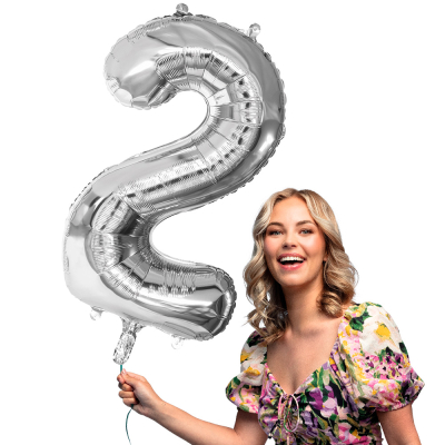 Silver foil balloon in the shape of the numeral 2.