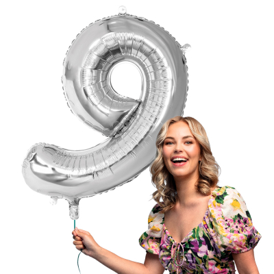 Silver foil balloon in the shape of the numeral 9.