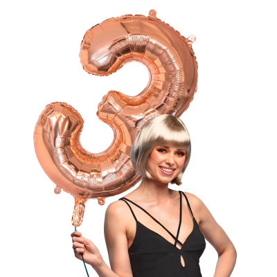Pink gold foil balloon in the shape of the number 3.
