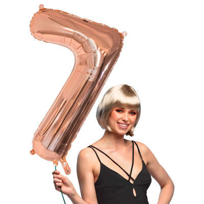 Pink gold foil balloon in the shape of the numeral 7.
