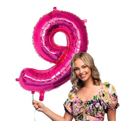 Pink foil balloon in the shape of the numeral 9.