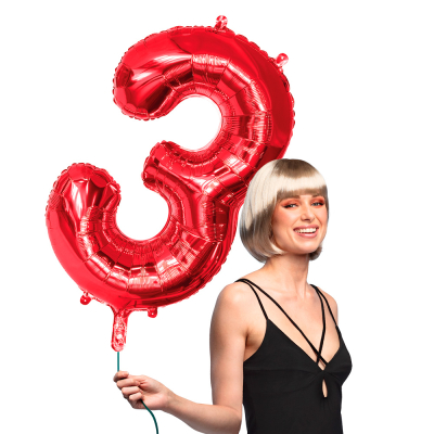 Red foil balloon in the shape of the numeral 3.