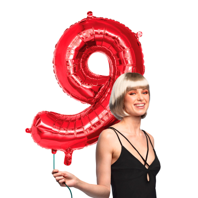 Red foil balloon in the shape of the numeral 9.