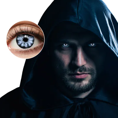 A mystery man wears a dark cape that makes it hard to see his face, but he has white contact lenses in.