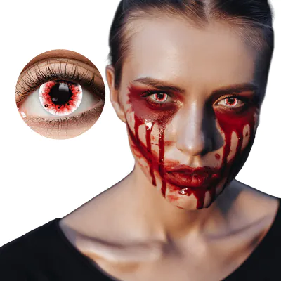Woman wears creepy Halloween make-up with fake blood around her eyes and mouth and she has contact lenses in with a blood splatter motif for an extra scary Halloween look.