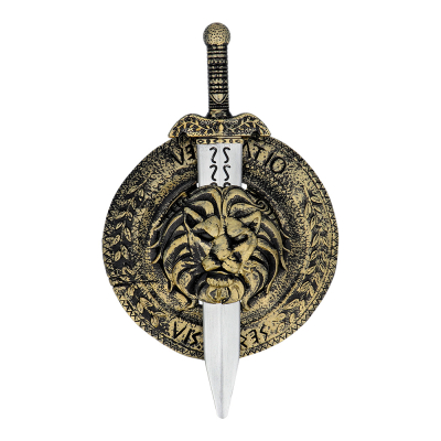Gold shield with lion's head with toy sword slid into it.