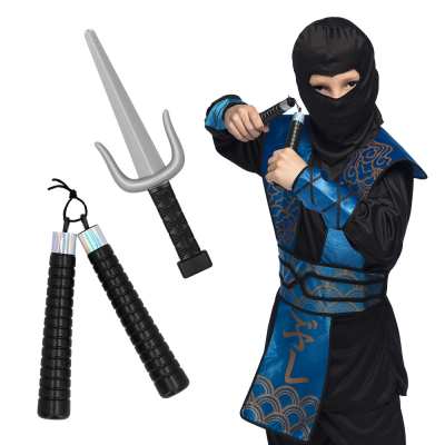 Boy dressed as a ninja in black/blue costume and holding a nunchaku in his hand. Next to him you can see the nunchaku loose with a dagger next to it.