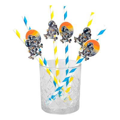 Glass with blue/white and yellow/white straws with Space decoration.