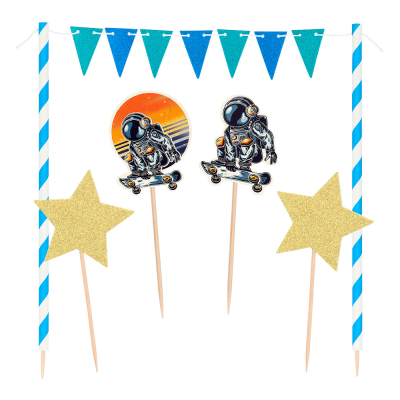 Space cake decoration kit with 2 astronauts and 2 gold stars on toothpicks and 2 sticks with a mini flag line in between.