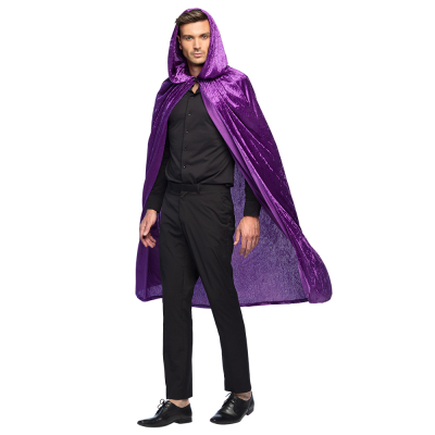 Man in black dress wears a purple, shiny hooded Halloween cape.