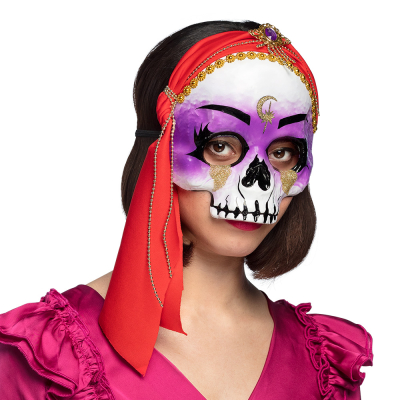 Woman wearing half face mask of a fortune teller skull with a red headscarf.