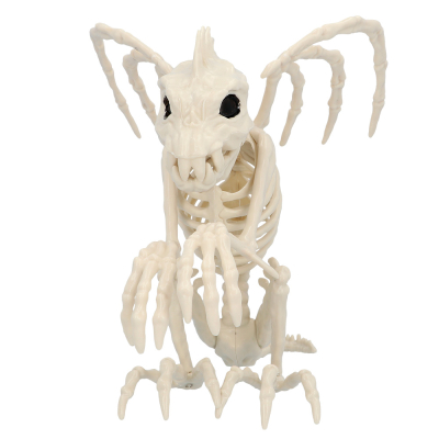Halloween decoration of a skeleton of a gargoyle dragon, gargouille, with wings and black eyes.