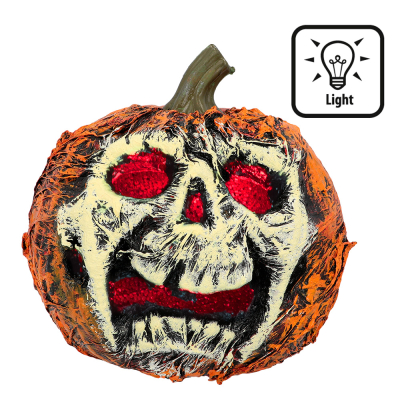 Halloween decoration of a pumpkin with a scary face and light on the inside so it looks like the eyes and mouth glow red.