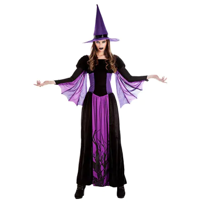 A woman wears a witch costume with long black dress with purple details and purple wide sleeves and a matching witch hat.