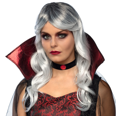 Woman wearing a vampire costume with high collar, a choker with red stone and a wig with long wavy grey white hair with a curtain fringe.