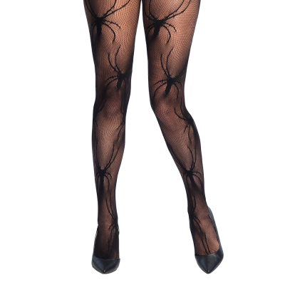 Legs of a woman wearing black net tights with black spiders on them.