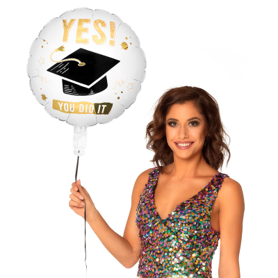White foil balloon with imprint of graduation hat and the text 'Yes you did it'.