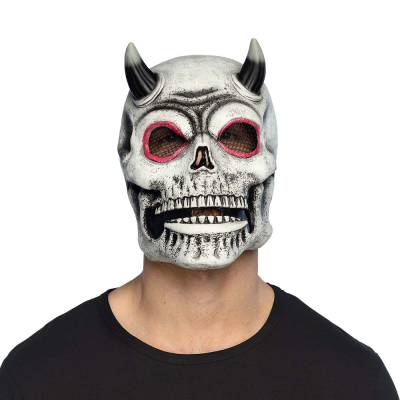 Man wearing a latex devil skeleton mask with red rims around the eyes and black horns.