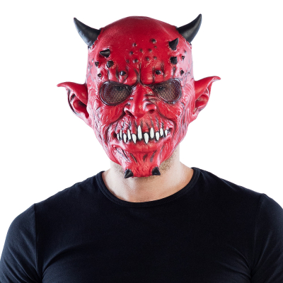 Man wearing a red devil halloween latex mask with black devil horns, scary teeth and pointed ears.