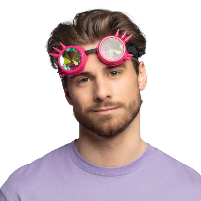 Blonde man wears neon pink party glasses with spikes and kaleidoscope lenses on his forehead.