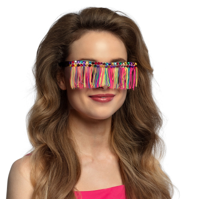 Smiling woman with long wavy blonde hair wears unusual party glasses with black frame, coloured stones and in front of the lenses coloured fringes.