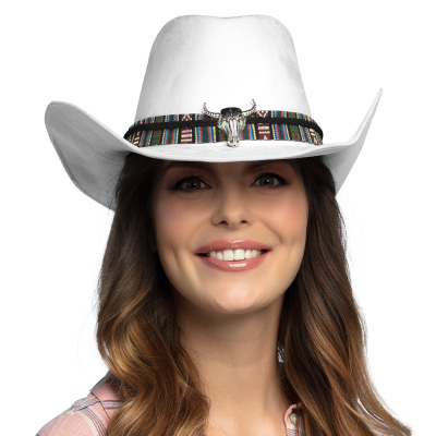 Man with flannel checked shirt has a white cowboy hat on with a fabric band with wild west pattern and silver bulls head as details.