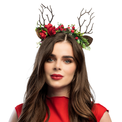 A woman wearing a diadem with deer antlers, flowers and berries, perfect for Christmas parties or a winter wonderland theme.