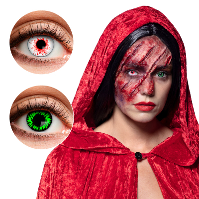 Oog met witte Halloween lens met bloedspetters en een oog met een groen/zwarte Halloween lens.