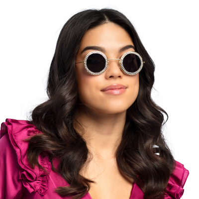 Woman with round hippie glasses with black glasses and coloured diamonds all around.