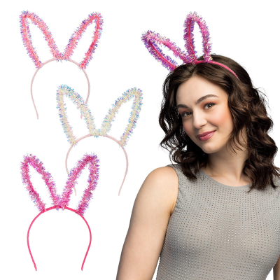 Woman with glitter bunny ears diadem in bright pink, light pink and pearly white, festive accessory for Easter, carnival, festivals and fancy dress parties