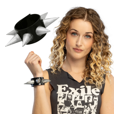 A cool woman has her arm raised; on her wrist she wears a wide black bracelet with large silver spikes for a cool punk & rock look.
