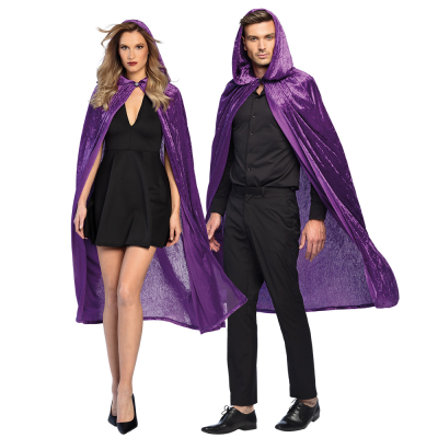 Man in black dress wears a purple, shiny hooded Halloween cape.