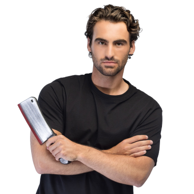 A man wearing a black t-shirt has his arms crossed and holds in one hand a fake butcher knife with bloody details as an accessory for his Halloween costume.