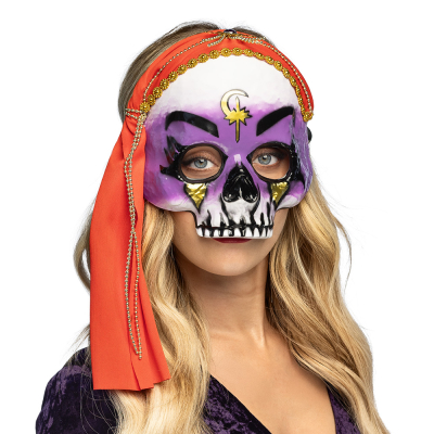 Woman wearing half face mask of a fortune teller skull with a red headscarf.