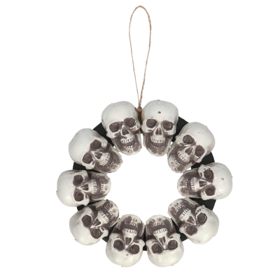 Halloween laurel wreath with skulls. There is a loop at the top.