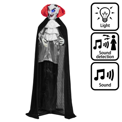 Staande halloweendecoratie van een lachende vampier met hoektanden, rood/zwarte cape, ogen die rood en blauw oplichten en enge geluiden maakt.