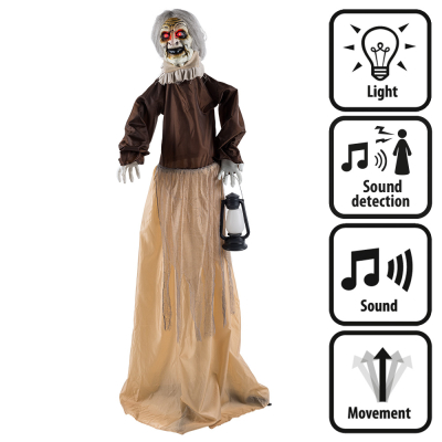 A life-size, standing Halloween decoration of an old witch wearing a worn brown, long dress, a lantern in her hand and a creepy face. The doll makes scary sounds, moves, has glowing red eyes and is activated by sound.
