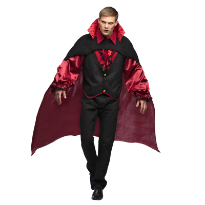 A man is wearing a Halloween vampire costume consisting of a black and red long-sleeved shirt and a long black and red cape with a high collar.