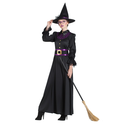 A woman wears a size XL Halloween witch costume consisting of a long black dress with long sleeves and lace details, a wide purple belt and a matching witch's hat.