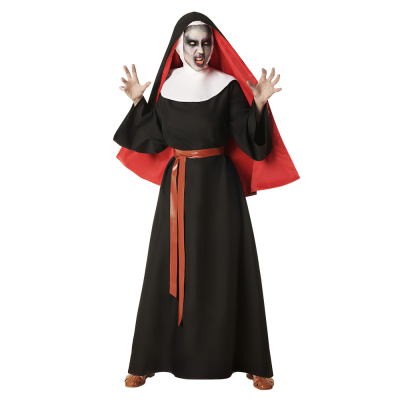 A woman wears a creepy nun costume for Halloween with a long black robe, a red belt, a black/red nun cap and white collar.