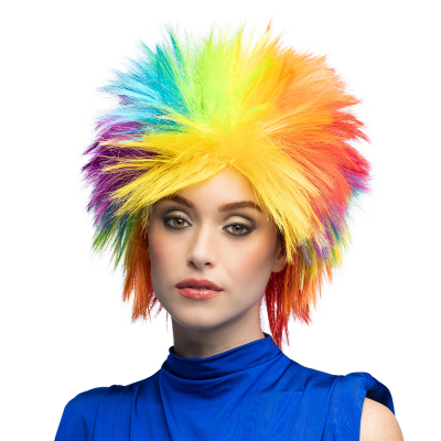 Woman wearing a wild rainbow wig with spiky hair in bright colours (yellow, red, orange, green, blue and purple), perfect for festivals, pride or carnival parties.