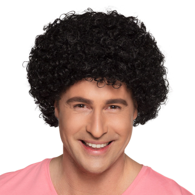 Man wears a short black afro wig as an accessory for a groovy disco costume for carnival or a fancy dress party.