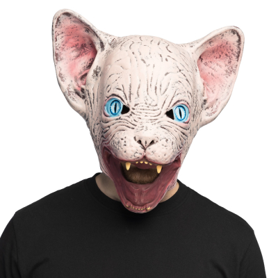 A man wearing a black t-shirt has on his head a latex mask of a creepy Siamese cat with big ears, big blue ears and pointy teeth.